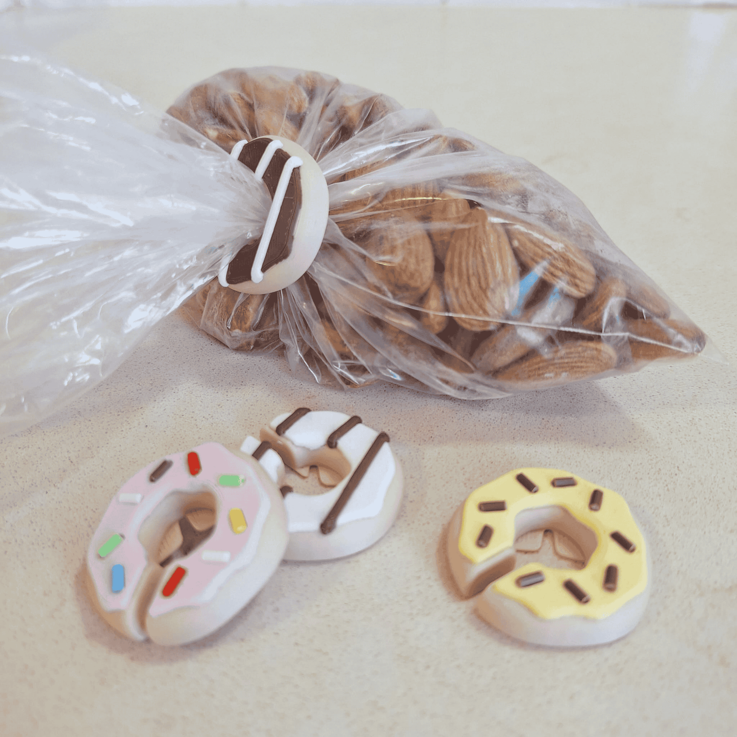 Cute donut bag clips with magnets for fridge storage.