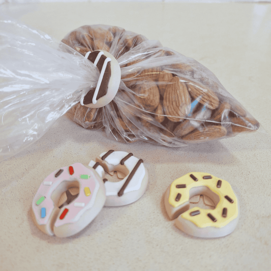 Cute donut bag clips with magnets for fridge storage.