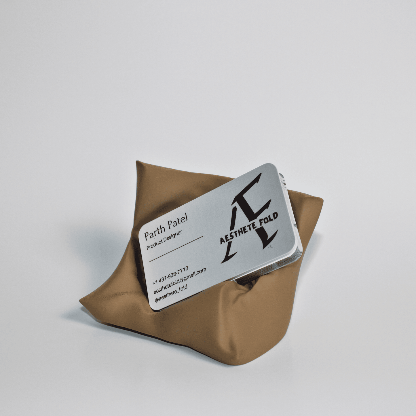 Pillow-inspired 3D printed business card holder on desk