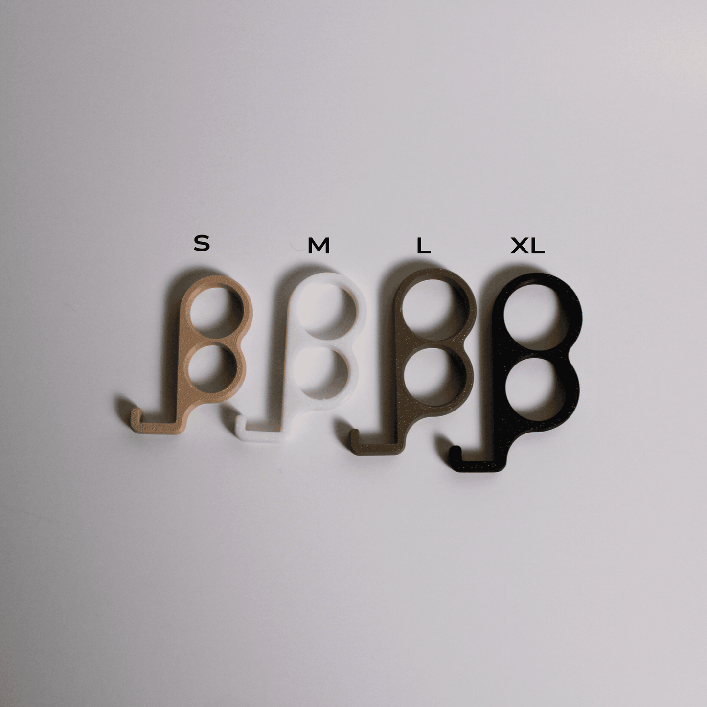 Four size markers labeled S, M, L, and XL on a light gray background.